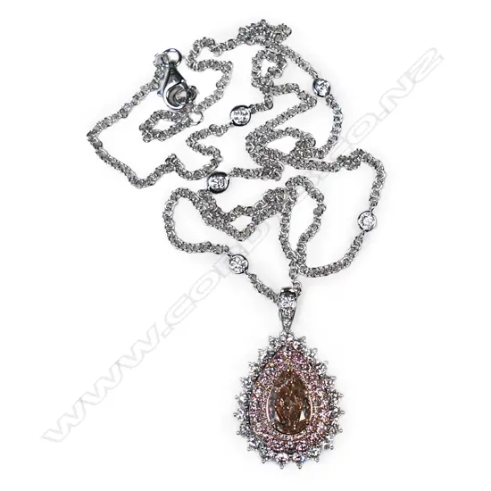 An 18ct white gold and pink diamond ring/pendant,