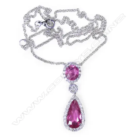 An 18ct white gold pink tourmaline and diamond pendant on chain,