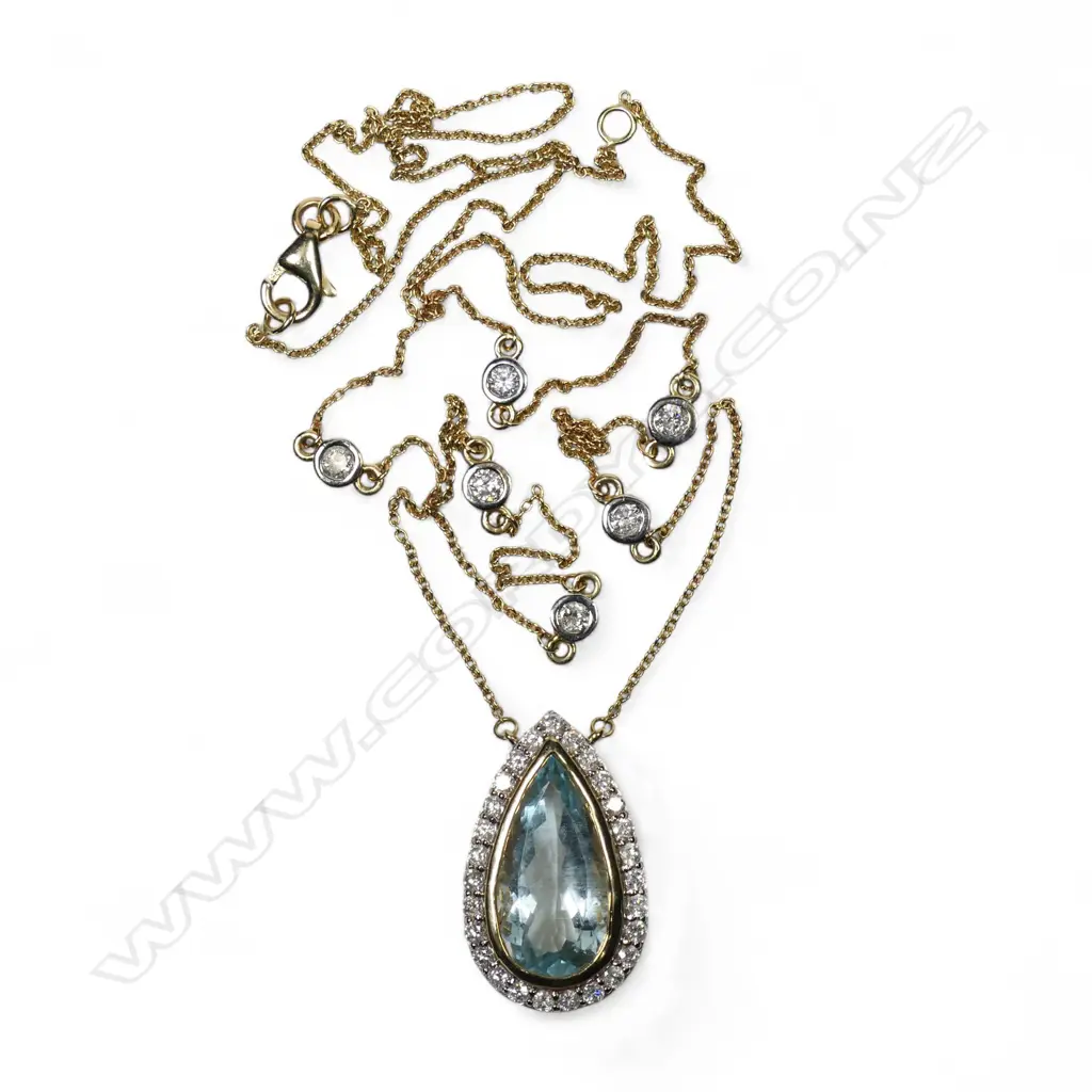 A 14ct gold aquamarine and diamond halo necklace, Image 1++