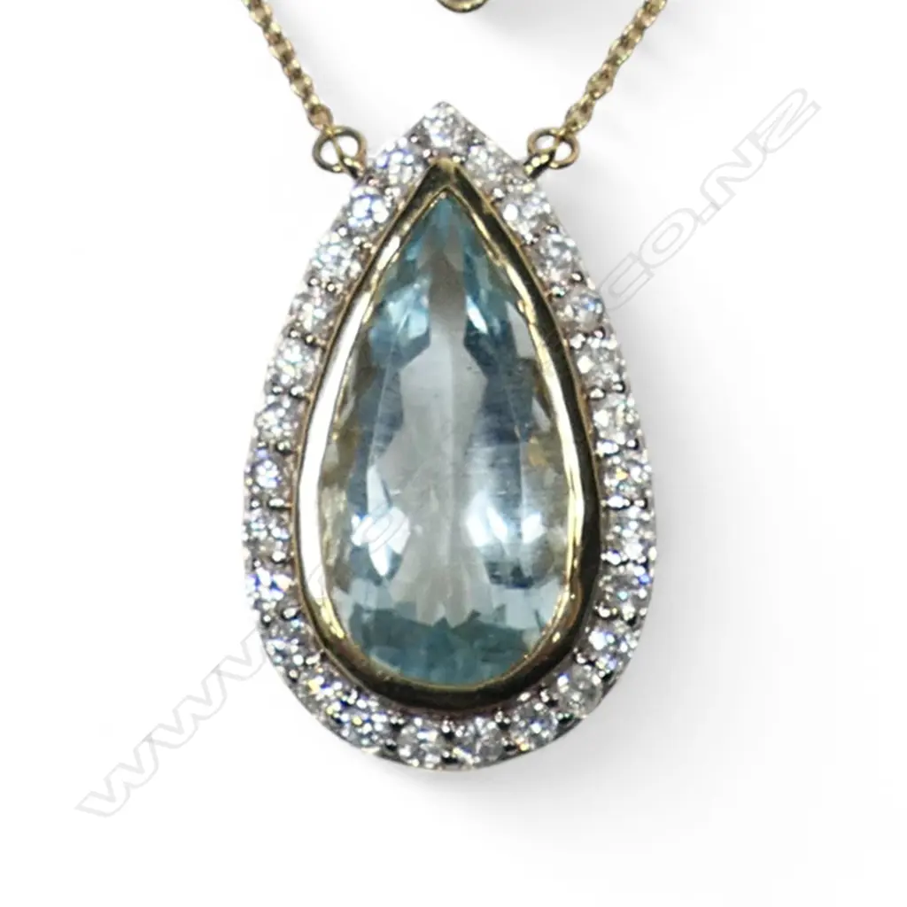 A 14ct gold aquamarine and diamond halo necklace, Image 1++