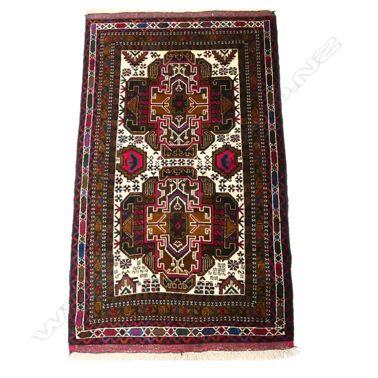 A small handknotted Baluchi rug,