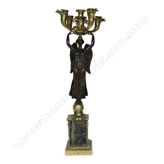 A 19thC French ormolu figured candelabra,
