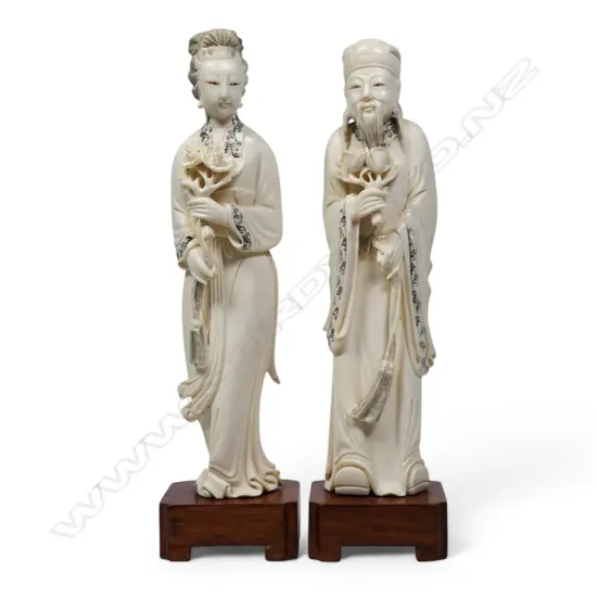 A pair of Chinese ivory figures,