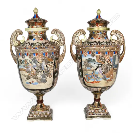 A pair of c.1900 Japanese Satsuma pedestal lidded urns,