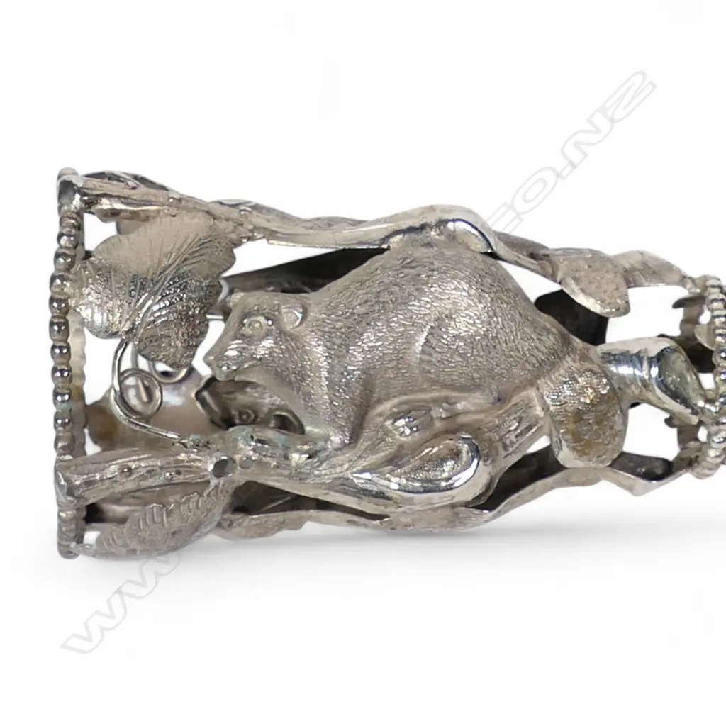 A possibly Canadian unmarked silver posy holder with beaver panels, Image 1++