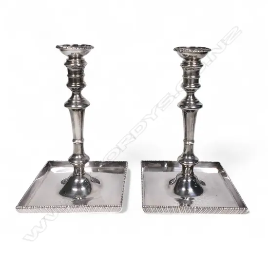 A pair of Georgian style silver candlesticks,