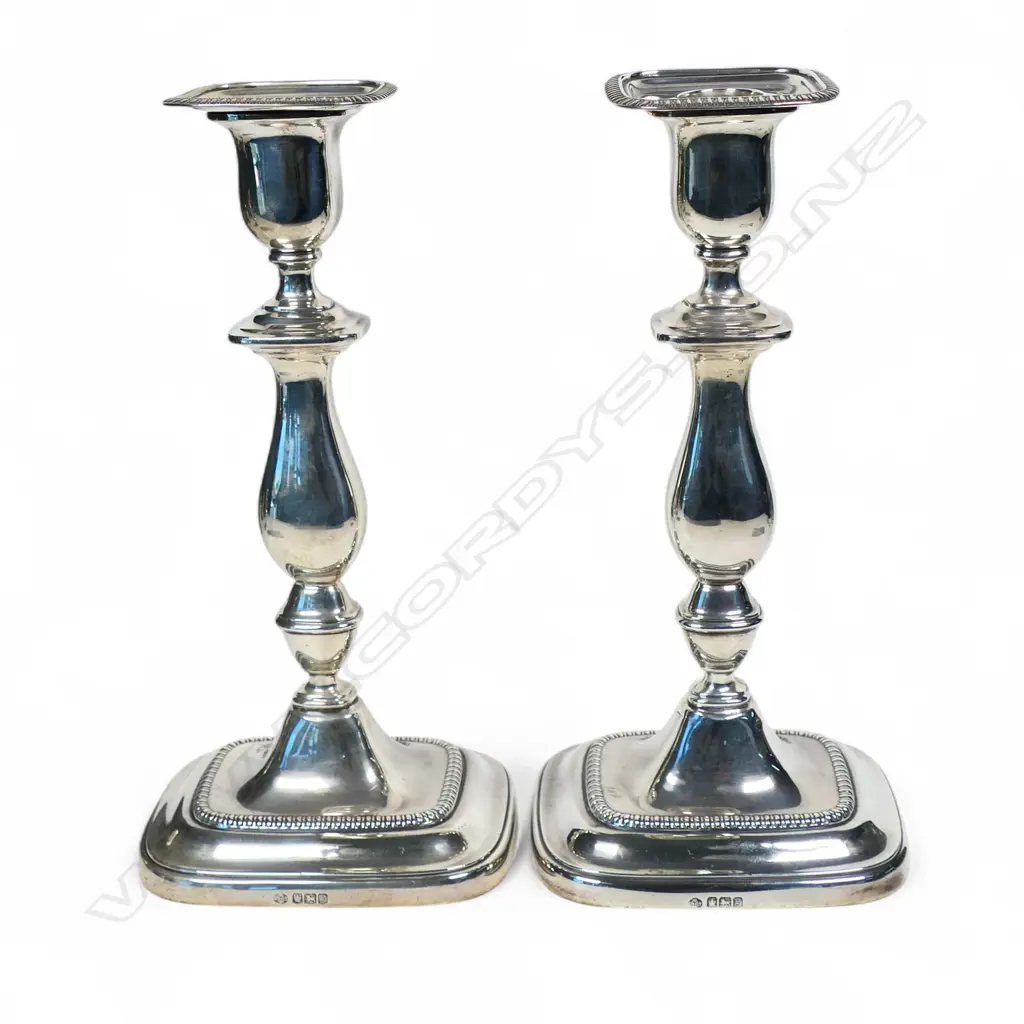 A pair of 1920's silver Georgian style loaded column candlesticks, Image 1++