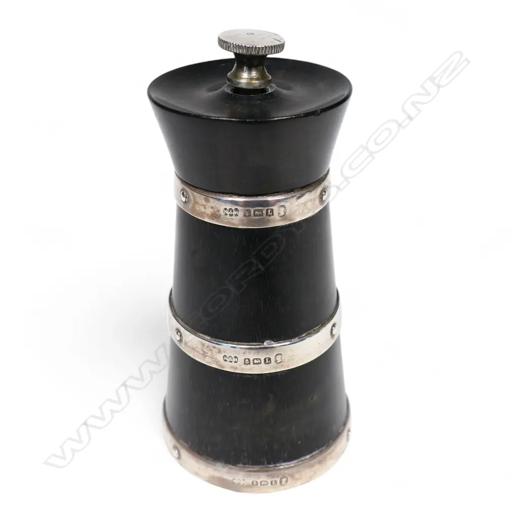 An ebony and silver banded pepper grinder, Image 1++