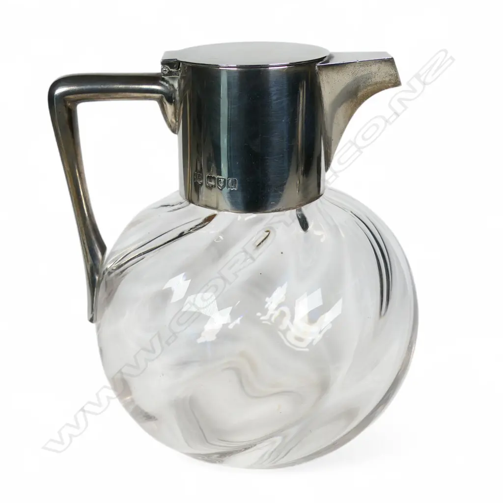 A late Victorian Christopher Dresser design silver and glass claret jug, Image 1++