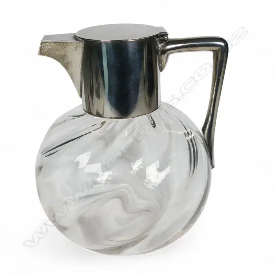 A late Victorian Christopher Dresser design silver and glass claret jug,