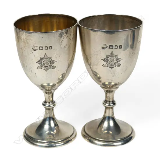 A pair of military Irish Guards silver small goblets,
