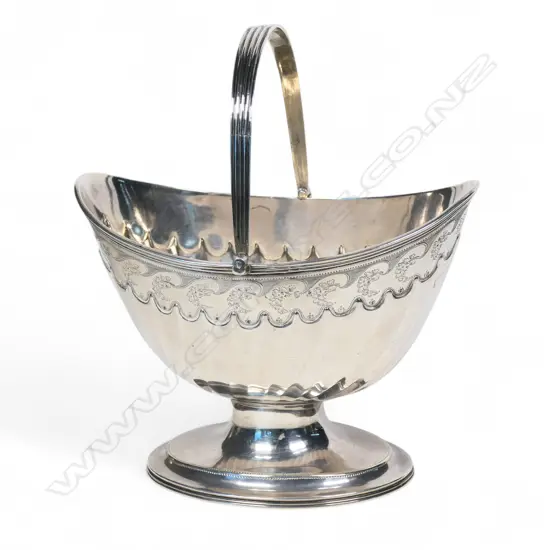 A George III silver swing handle pedestal sugar pail,