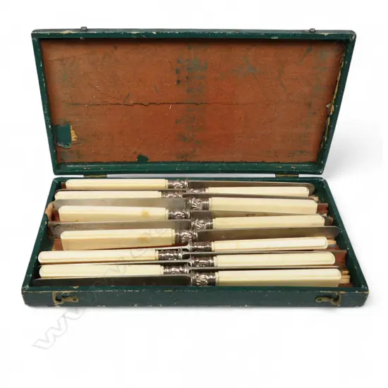 A set of twelve 19thC French silver and ivory handled knives,