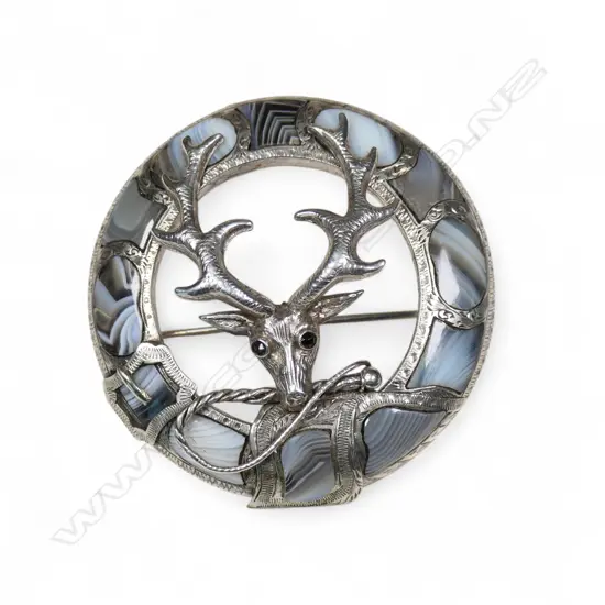 A late Victorian Scottish silver and banded agate stags head brooch,