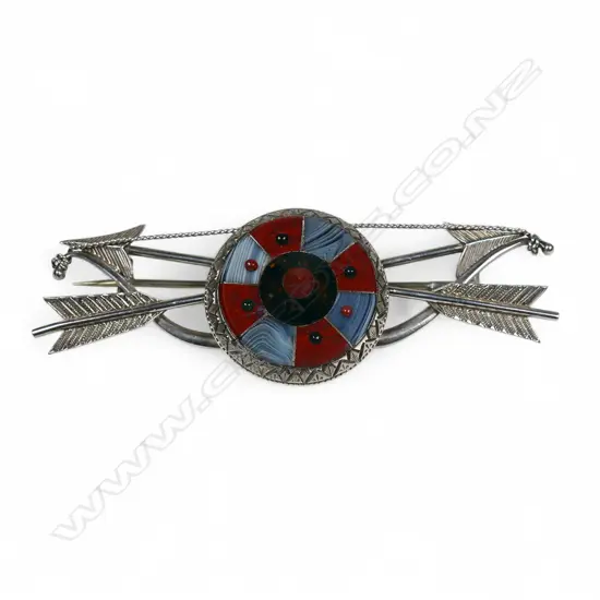 An uncommon late Victorian silver and agate bow arrows and target brooch,
