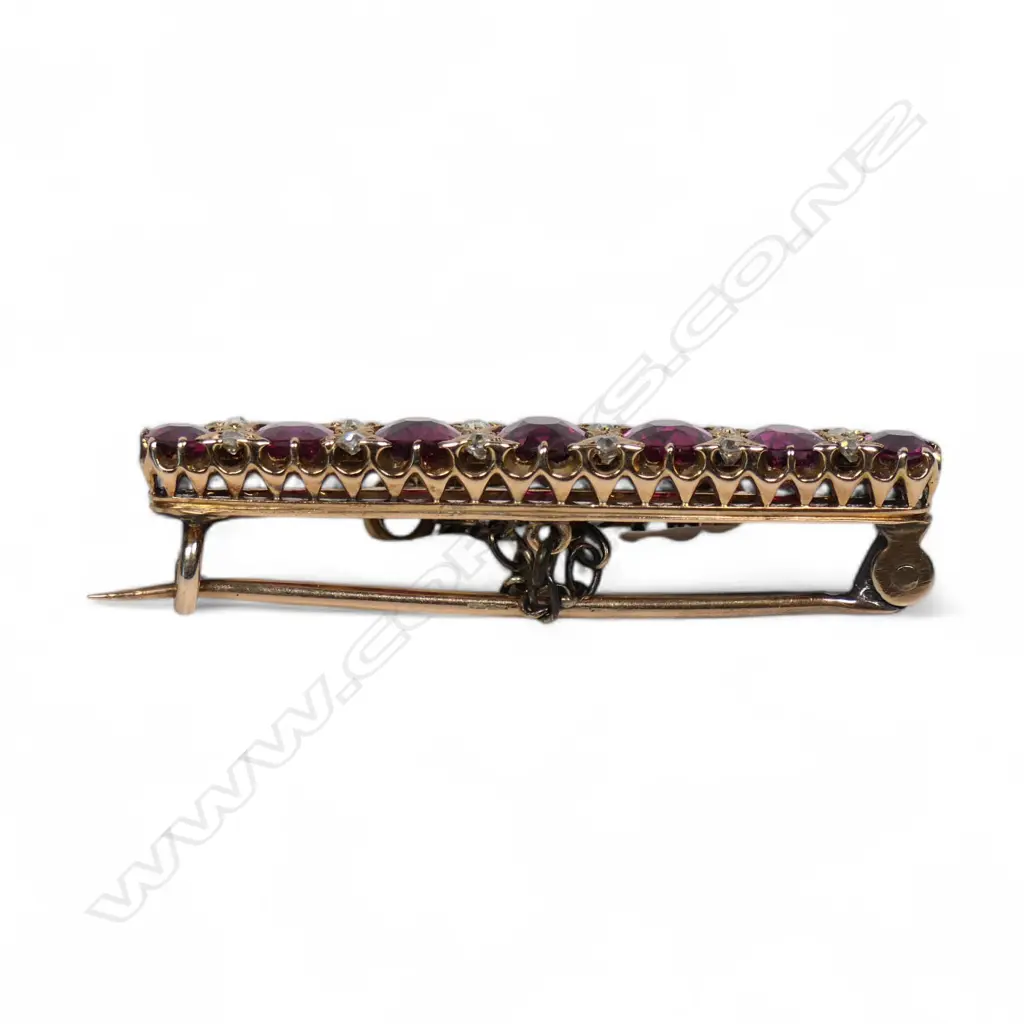 An estate 15ct gold ruby and diamond brooch, Image 1++