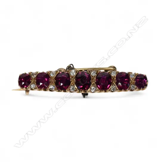 An estate 15ct gold ruby and diamond brooch,