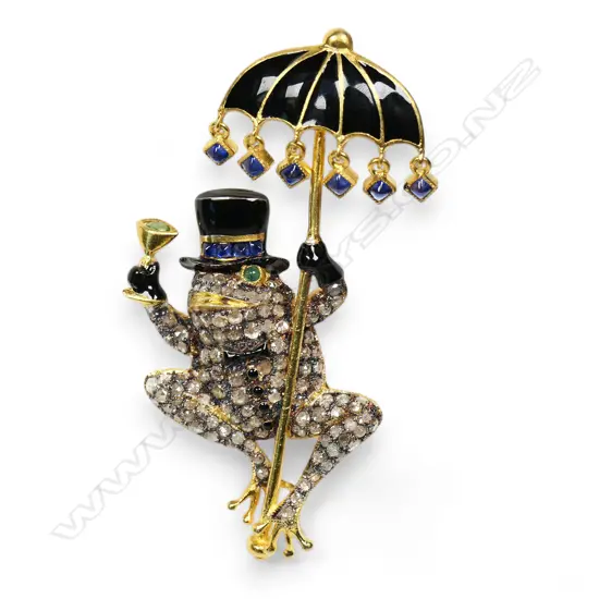 A silver gilt figural brooch,