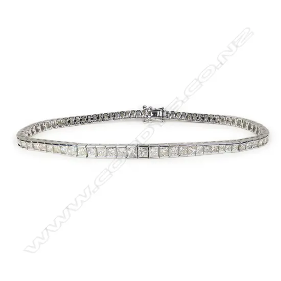 A modern 18ct white gold and diamond line bracelet,