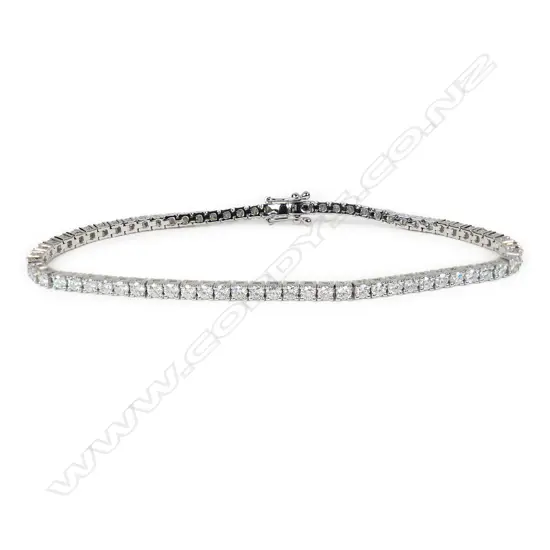 An 18ct white gold and diamond tennis bracelet,