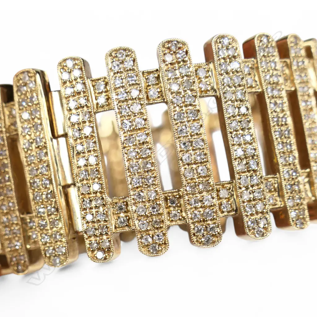 A 9ct yellow gold and multi diamond hinged bangle, Image 1++