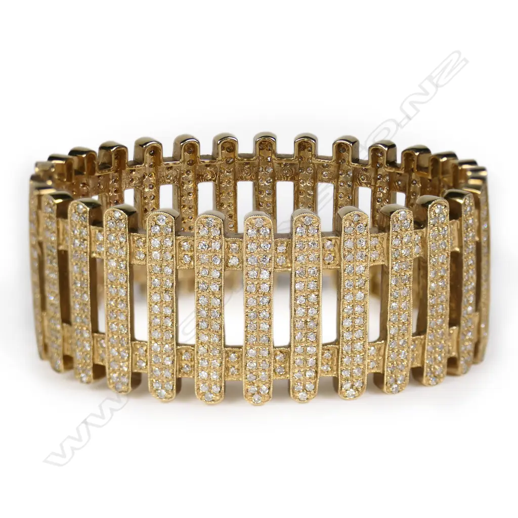 A 9ct yellow gold and multi diamond hinged bangle, Image 1++