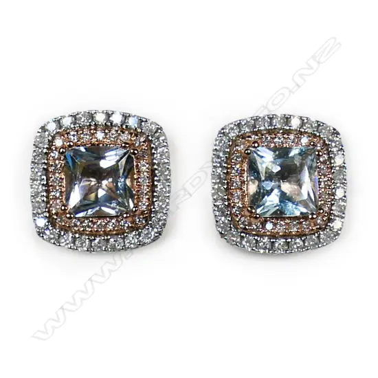 A pair of 14ct white and rose gold aquamarine and diamond halo stud earrings,