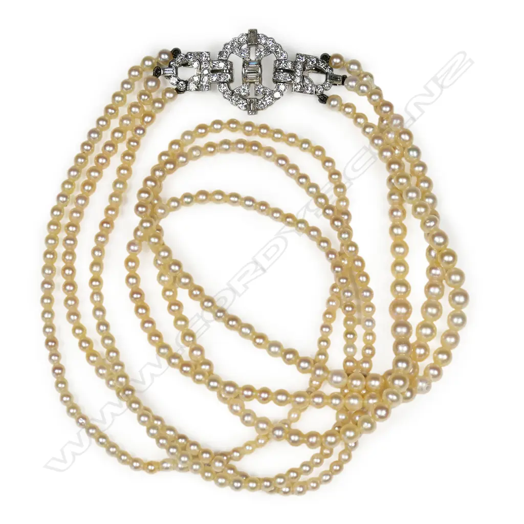 An uncommon natural pearl triple strand necklace with Art Deco platinum and diamond fancy clasp, Image 1++
