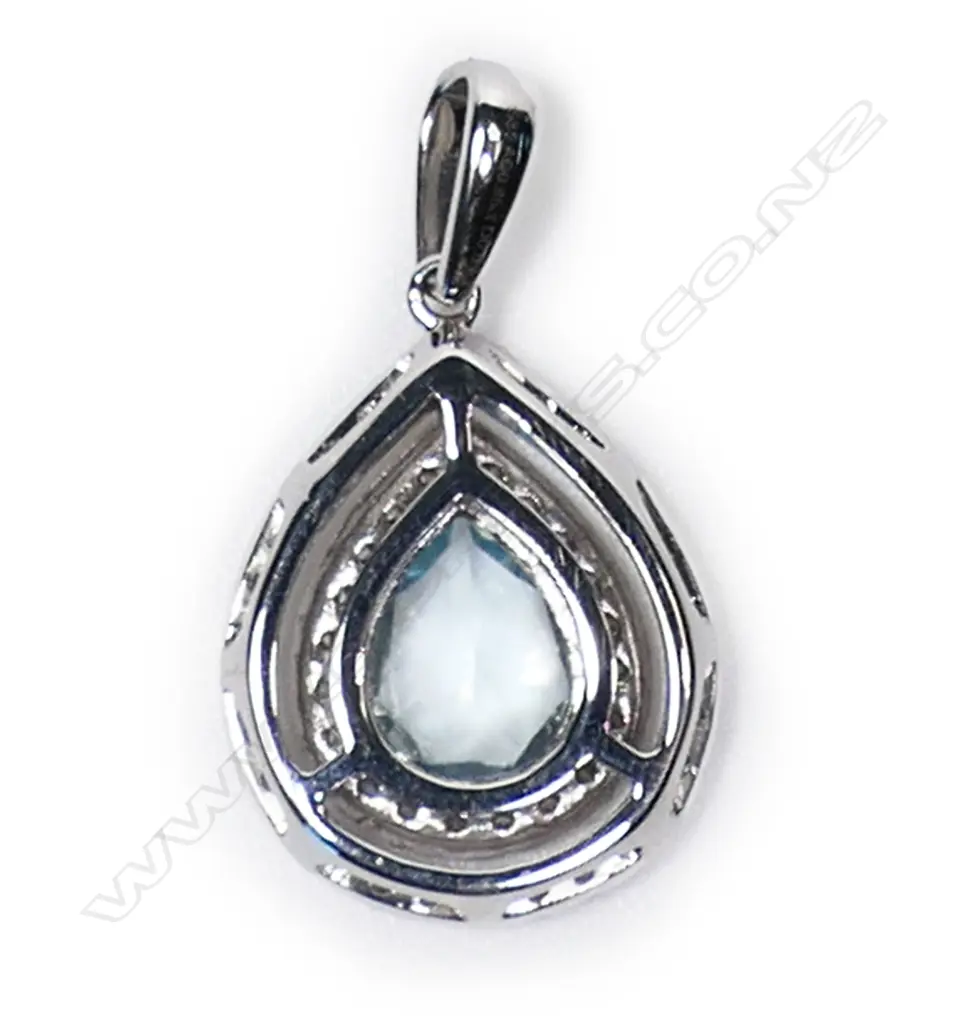 A 14ct white gold aquamarine and diamond double halo pendant, Image 1++