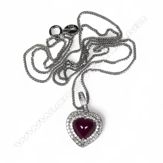 A modern 18ct white gold rubellite and diamond pendant on chain,