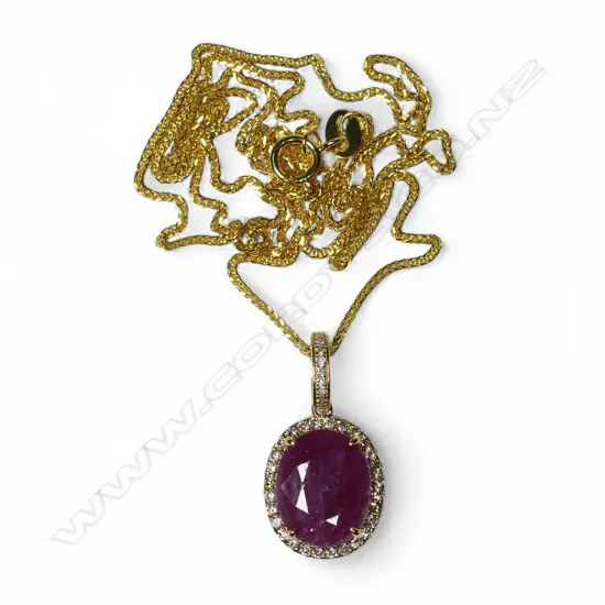 A modern 9ct yellow gold rubellite and diamond pendant on chain,