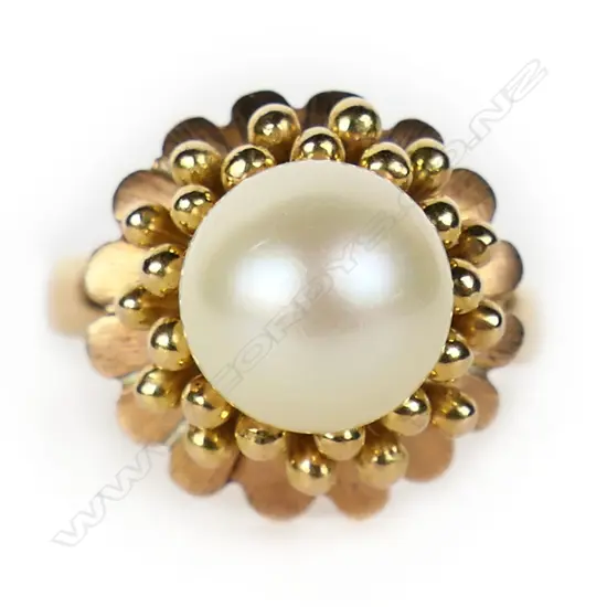 An 18ct gold and pearl dress ring,
