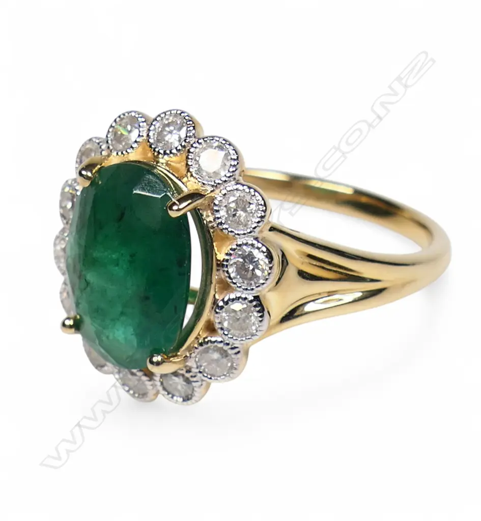 A 14ct gold emerald and diamond ring, Image 1++