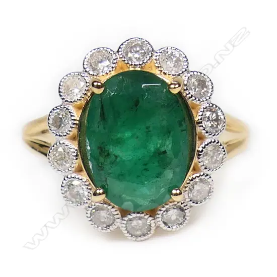 A 14ct gold emerald and diamond ring,