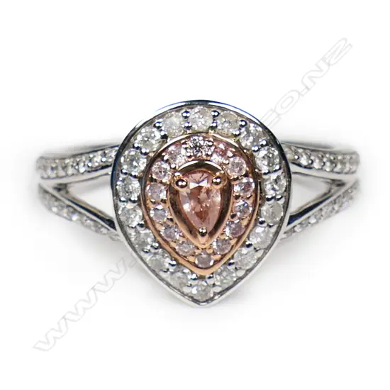 A 14ct white and rose gold pink diamond double halo split band ring,