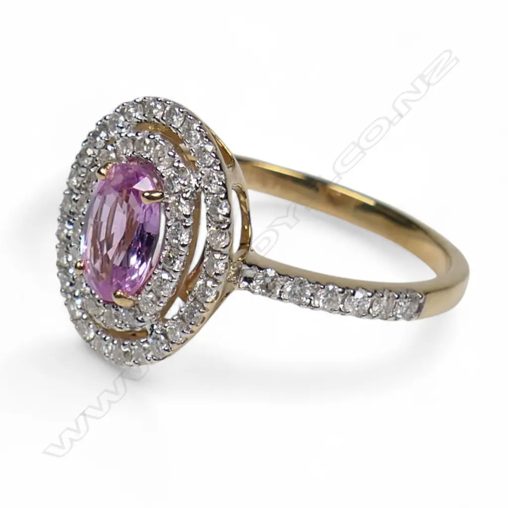 A 14ct gold pink sapphire and diamond double halo ring, Image 1++