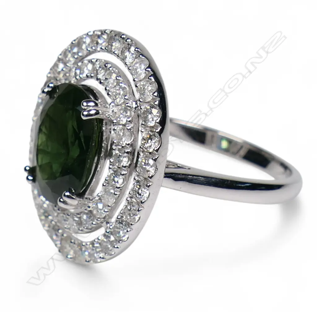 A 14ct white gold green sapphire and diamond double halo ring, Image 1++