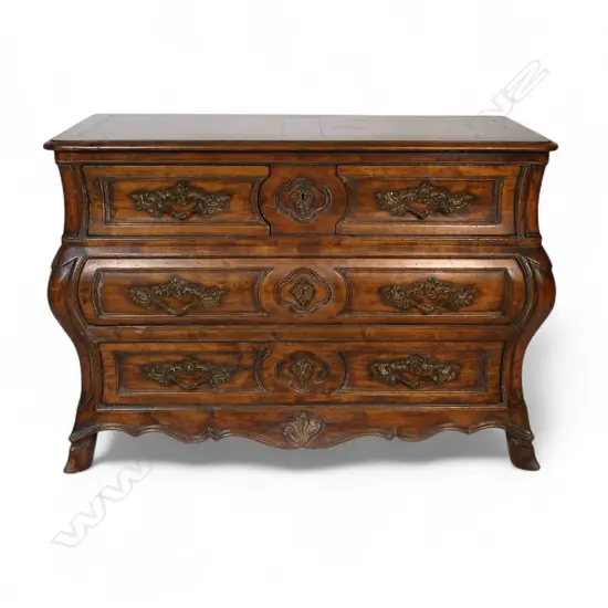 A French antique style walnut bombe commode,