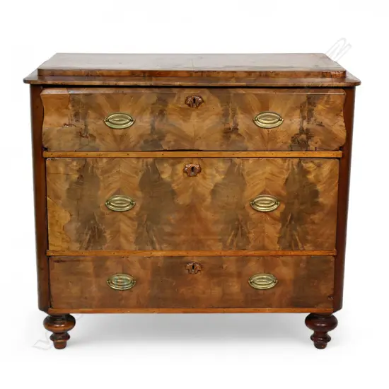 An early 20thC Biedermeier figured mahogany three drawer chest,