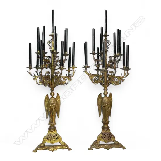A pair of impressive late 19thC gilded iron French church candelabra,
