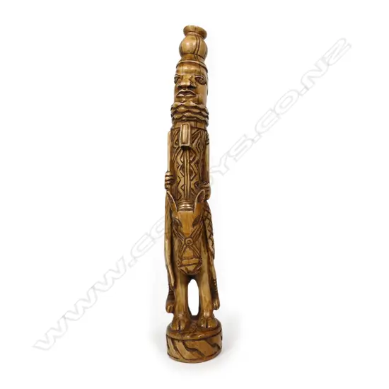 An early 20thC Nigerian carved ivory tusk section,