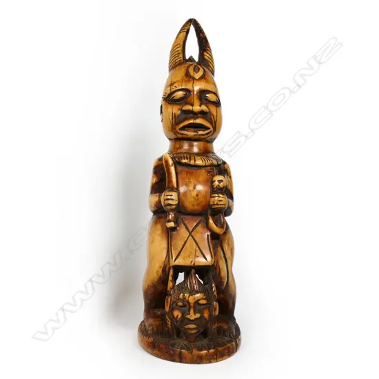 An early 20thC large, heavy and solid Nigerian carved ivory demonic Ibeji,