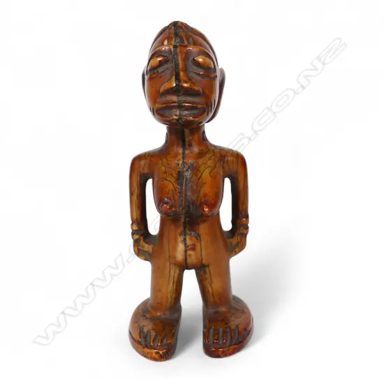 An early 20thC Nigerian Ere Ibeji ivory figure,