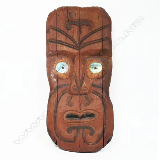 An early 20thC folk art carved Māori wheku gable mask,