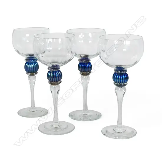 A set of four Garry Nash mouth blown glass drinking goblets,