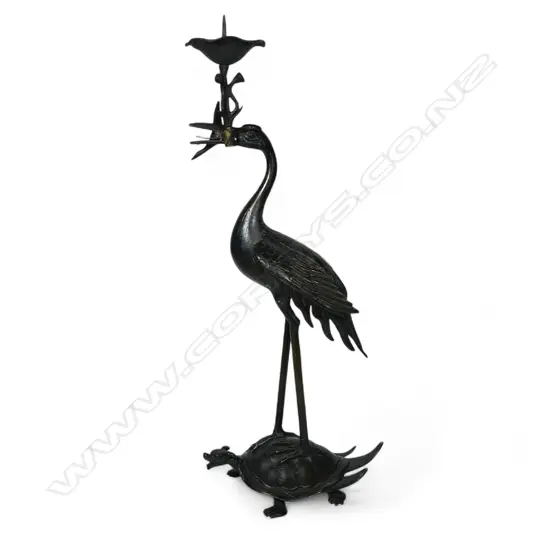 A 19thC Japanese bronze stork on crane figured pricket candlestick