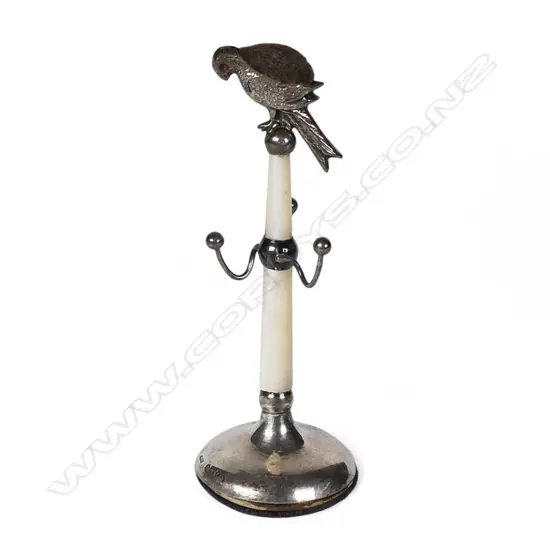 A 1920's silver and mother of pearl bird pin cushion,