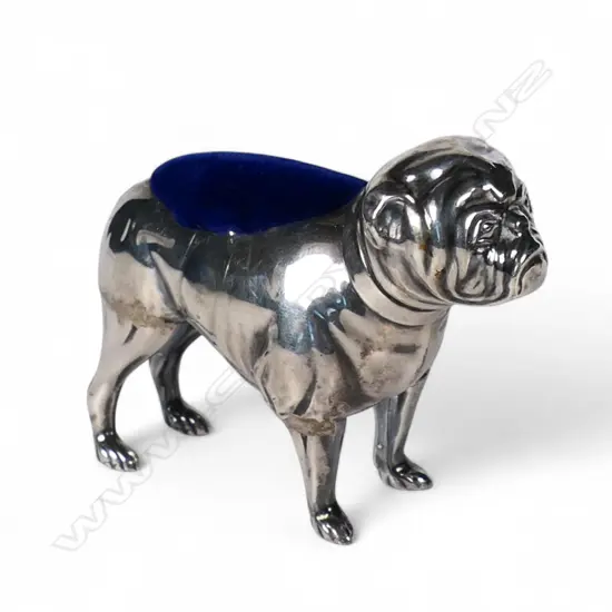 An Edwardian silver bull dog pin cushion,