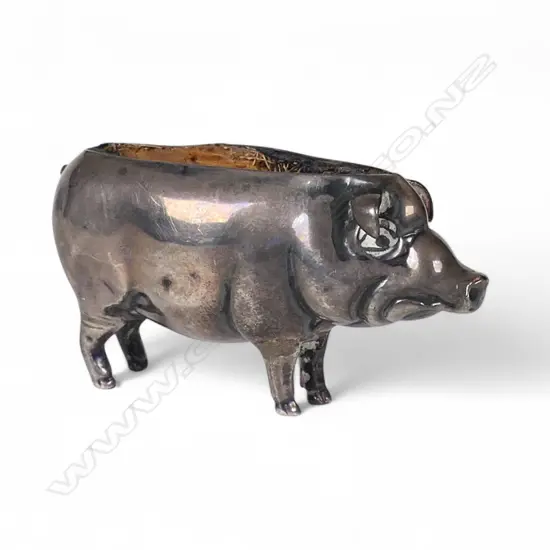 An Edwardian silver pig pin cushion,