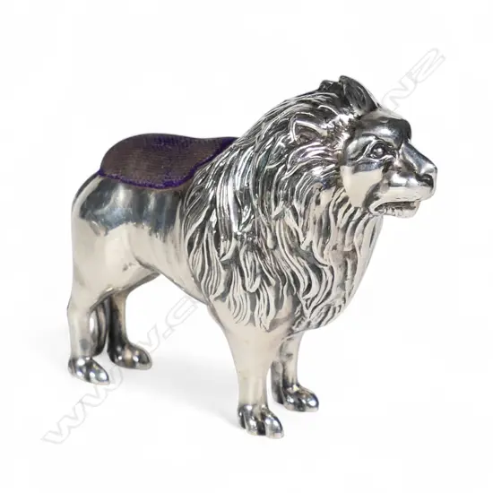 A rare Edwardian silver lion pin cushion,